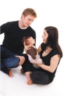 couple holding baby