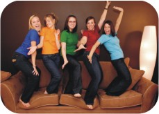 girls dancing on a couch