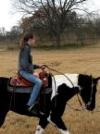 One of my friends, Keira, on my mom's horse Satin!