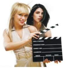 pretty girls holding clapboard